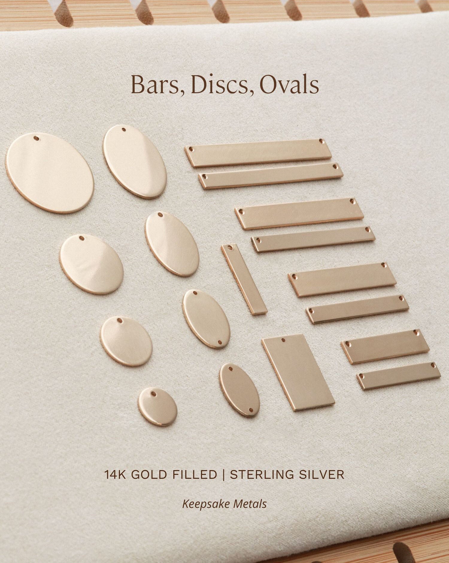 a collection of 14K gold-filled sterling silver metal discs and oval-shaped metal pieces arranged on a white background.