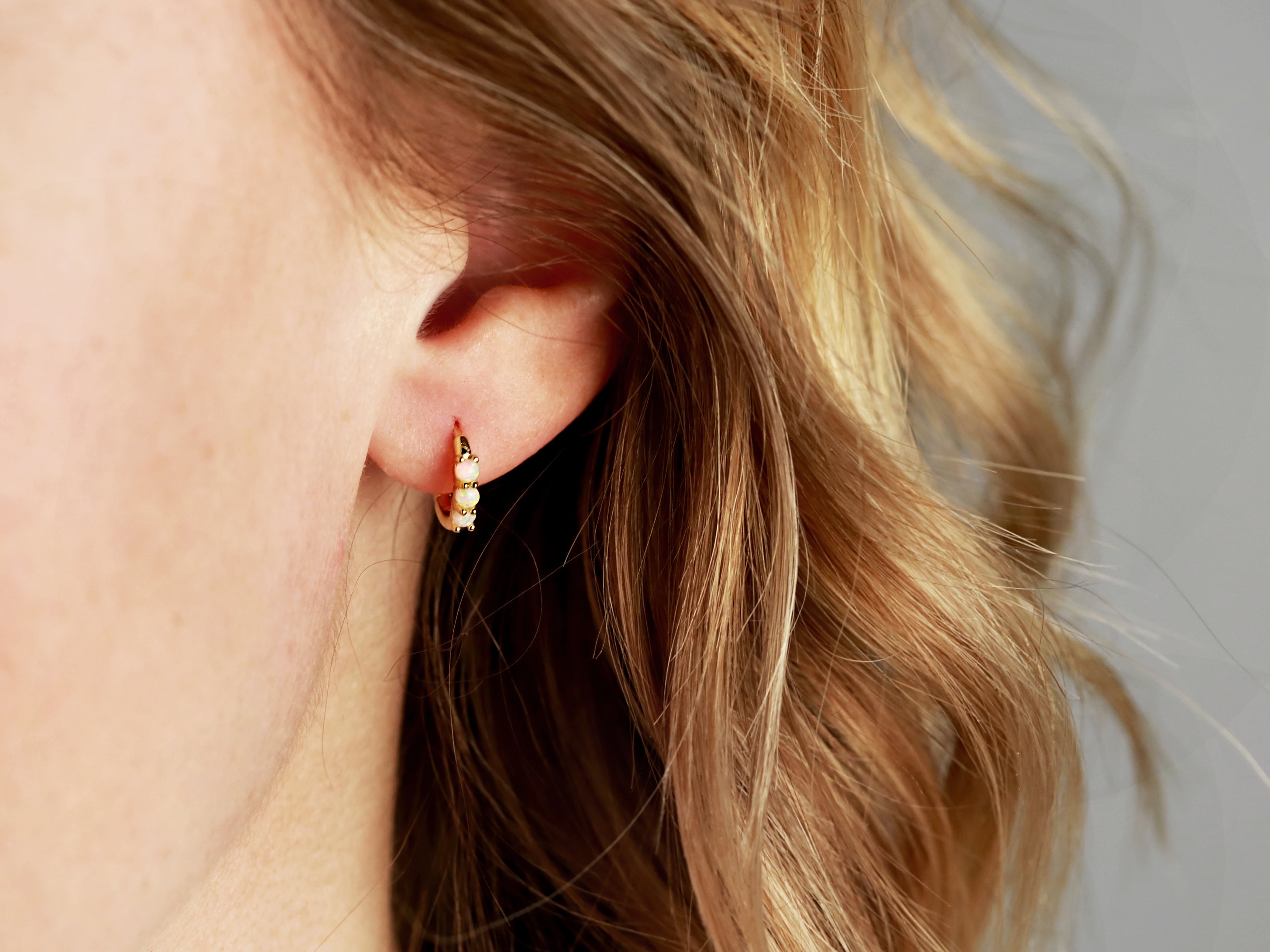 Opal tiny hoop earrings in silver and gold from Tom Design Shop.